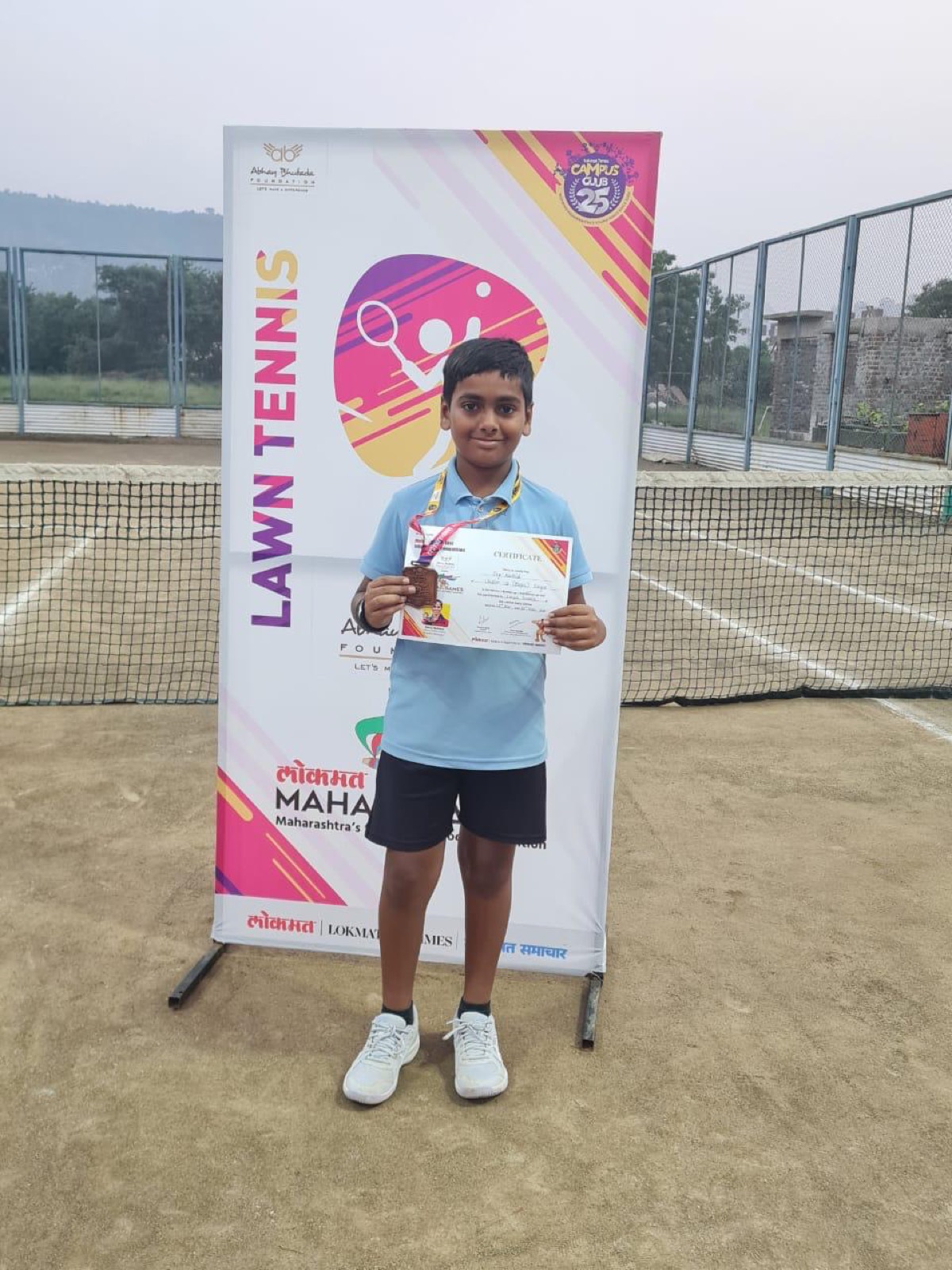 Young winner with medal & certificate
